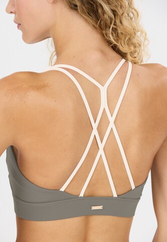 Athlecia Low support Sport bh 'Aspasia' in Groen