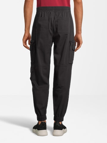 Effilé Pantalon cargo AÉROPOSTALE en noir