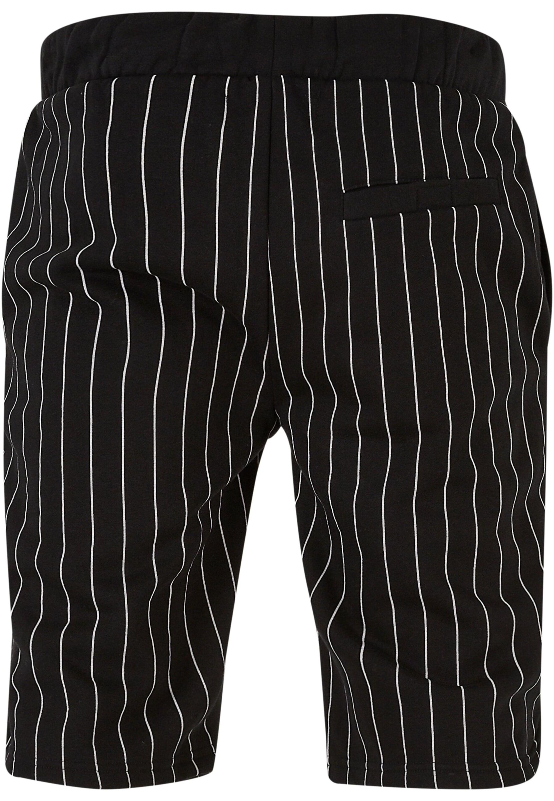 ROCAWEAR Regular Trousers in Black