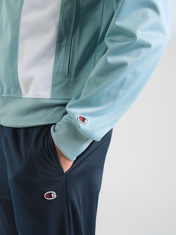 Champion Authentic Athletic Apparel Trainingspak in Blauw