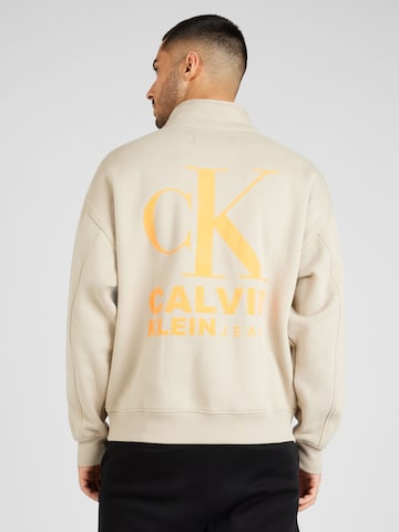 Sweat-shirt Calvin Klein Jeans en beige : devant