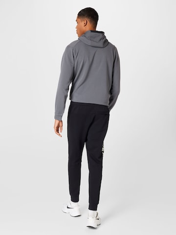 Effilé Pantalon 'Air' Nike Sportswear en noir