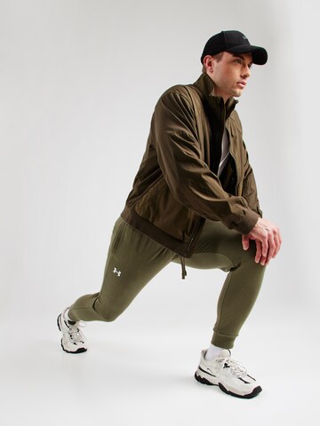 UNDER ARMOUR Tapered Sporthose in Grün