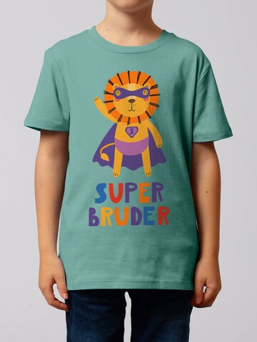 watabout.kids T-Shirt 'Löwe Superbruder' in Blau: Vorderseite