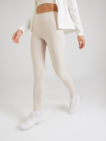 Girlfriend Collective Skinny Sports trousers in Brown: front