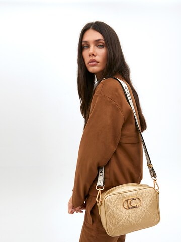 Sac à bandoulière Lola Casademunt en or : devant