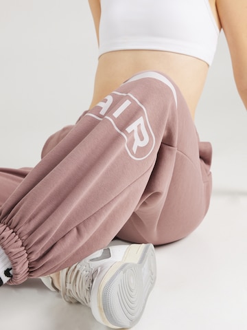Nike Sportswear Zwężany krój Spodnie 'AIR' w kolorze fioletowy