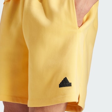 ADIDAS SPORTSWEAR Loose fit Workout Pants 'Z.N.E. Premium' in Yellow