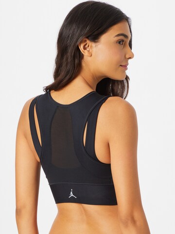 Bustino Reggiseno sportivo di NIKE in nero