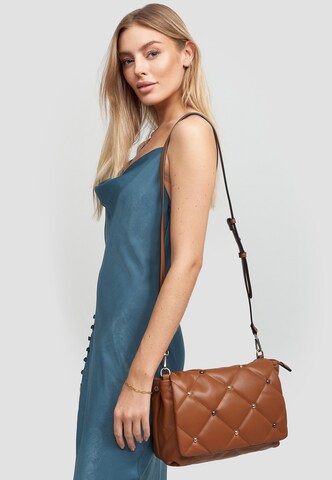 HARPA Crossbody Bag in Brown: front