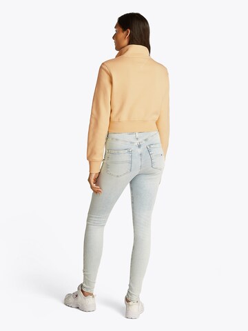 Tommy JeansSweater majica - žuta boja: stražnji dio