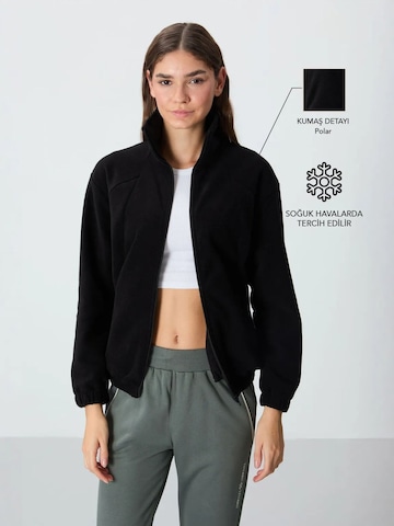 Tommy Life Bluzka sportowa w kolorze czarny: przód