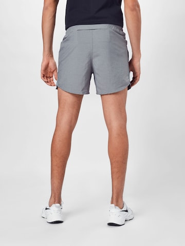 NIKE Regular Sports trousers in Grey