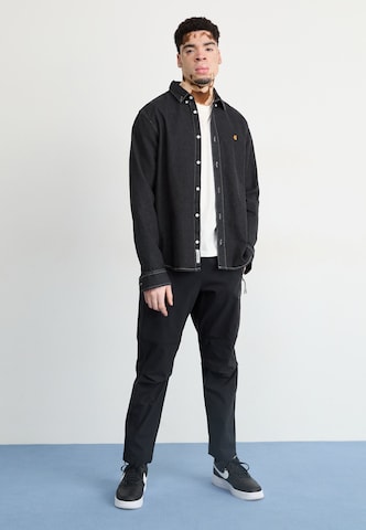 Nike Sportswear Tapered Byxa i svart
