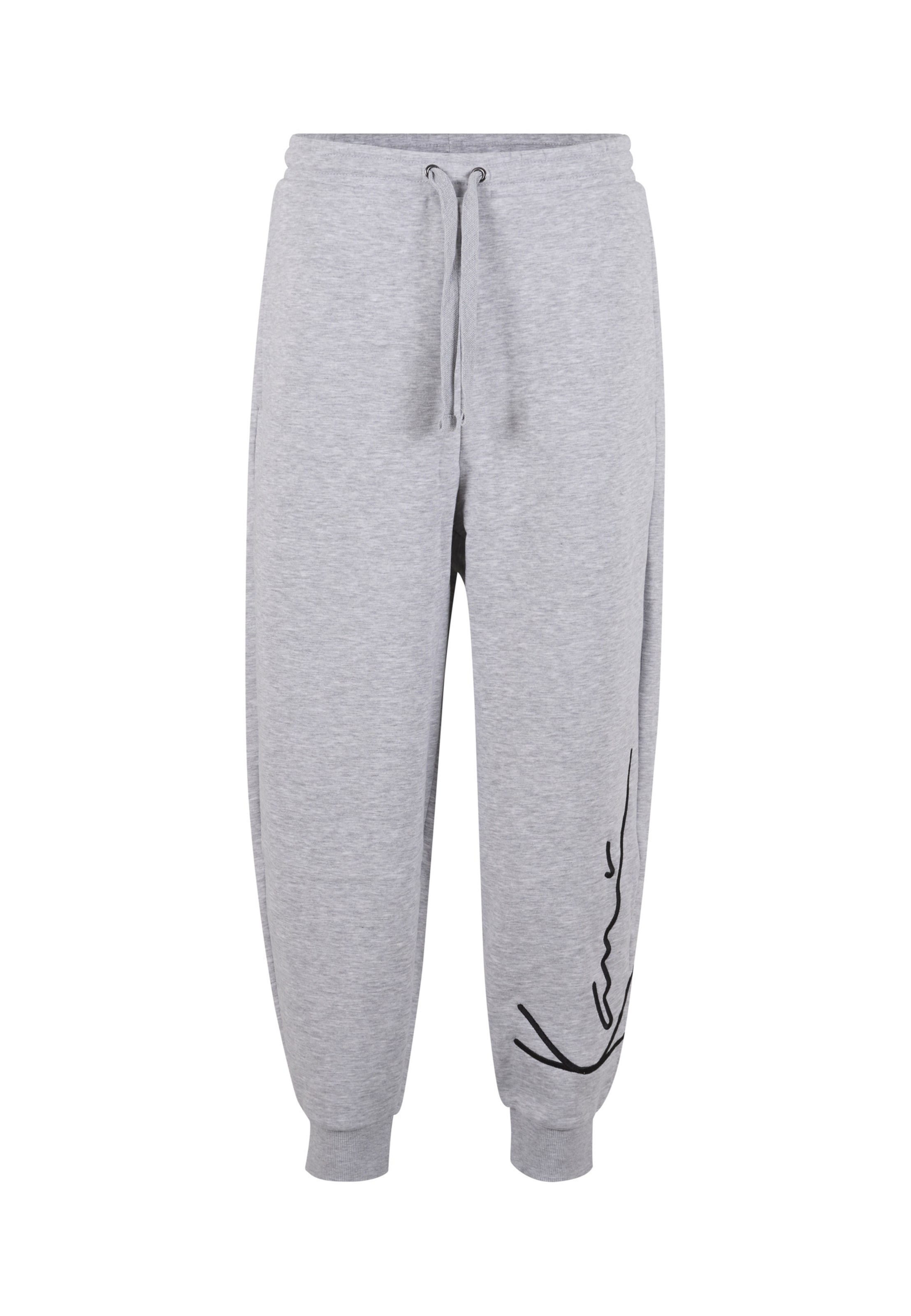 Karl Kani - Tapered Calças em cinzento: frente