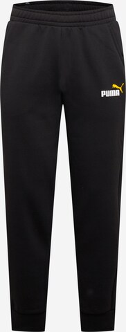 PUMA - Pantalón deportivo en negro: frente