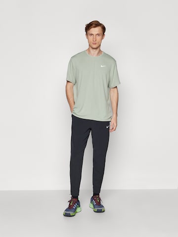 NIKE Tapered Workout Pants 'STRIDE' in Black