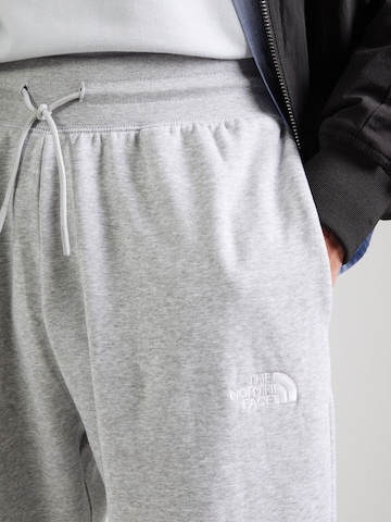 pilka THE NORTH FACE Siaurėjantis Kelnės 'ESSENTIAL'