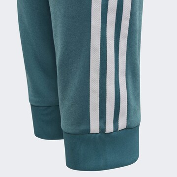ADIDAS ORIGINALS Tapered Sports trousers 'Adicolor SST' in Blue