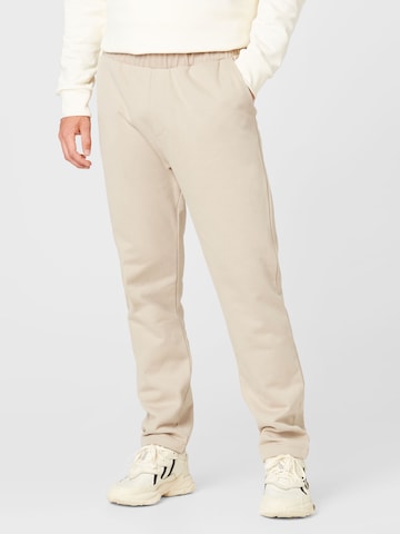 Kosta Williams x About You Pants in Beige: front