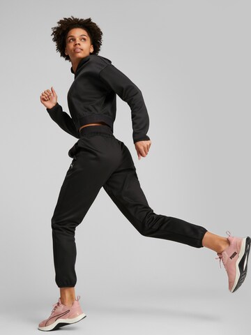 PUMATapered Sportske hlače 'Strong Powerfleece' - crna boja