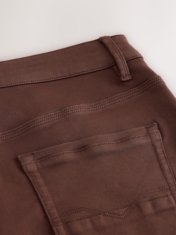 Next Slimfit Farkut värissä ruskea