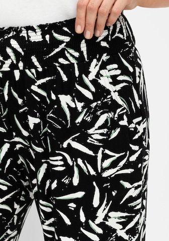 SHEEGO - Tapered Pantalón en negro