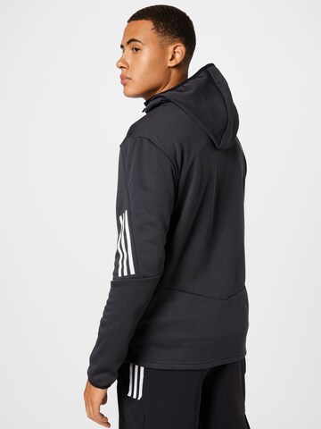 Veste de survêtement ADIDAS SPORTSWEAR en noir