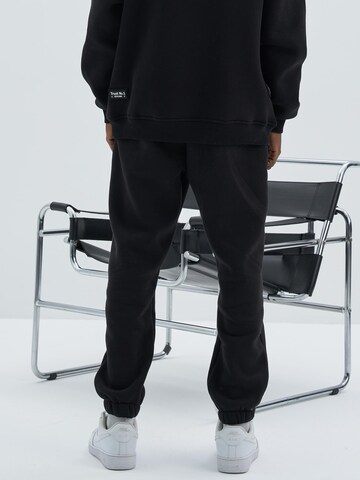 Koyumi Regular Workout Pants 'Jogginghose – 3-fädiger angerauter Stoff, elastischer Bund & Bündchen , Inspector' in Black