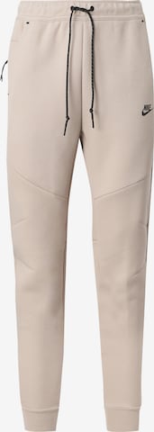 Nike Sportswear Tapered Housut 'Tech Fleece' värissä beige: etupuoli