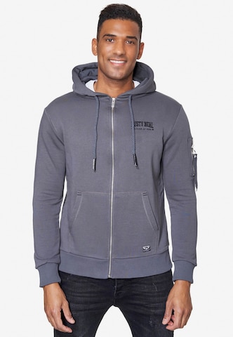 Rusty Neal Zip-Up Hoodie in Grey: front