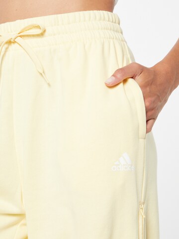 ADIDAS SPORTSWEAR Tapered Sportsbukser 'Hyperglam 3-Stripes Cuffed With Side s' i gul