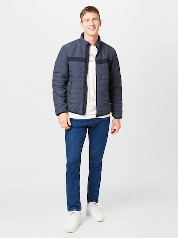 TOMMY HILFIGER Tussenjas in Blauw