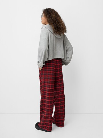 Bershka Loose fit Pleat-front trousers in Red