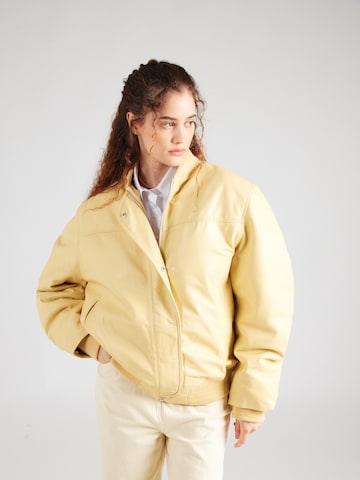 REMAIN Prehodna jakna | rumena barva: sprednja stran