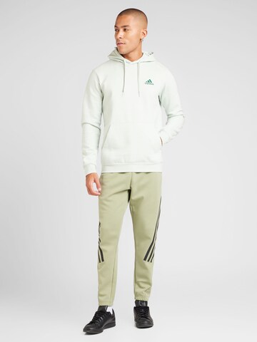 ADIDAS SPORTSWEAR Tapered Sports trousers 'Future Icons' in Green