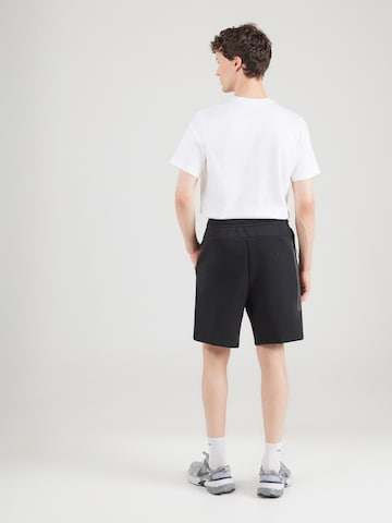 Regular Pantalon 'TCH FLC' Nike Sportswear en noir