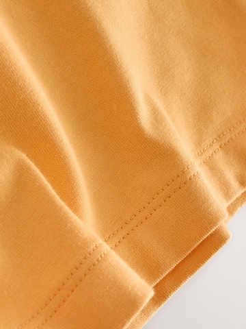 Next Paita värissä oranssi