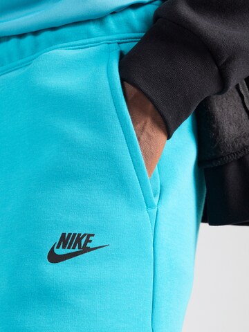 Nike Sportswear Свободный крой Штаны 'TCH FLC' в Зеленый