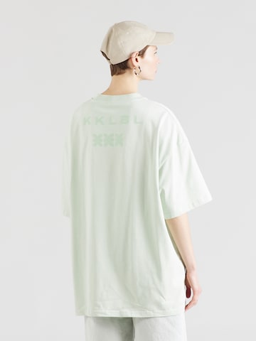 T-shirt oversize Karo Kauer en vert : devant
