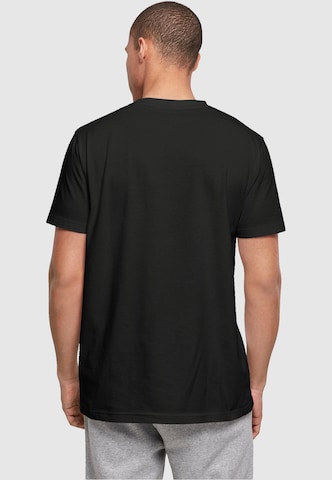 T-Shirt 'Caution Hot' Merchcode en noir