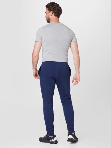 Effilé Pantalon de sport Reebok en bleu