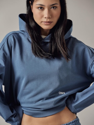 OWN Off With Nature - Sudadera 'Cappuccio' en azul