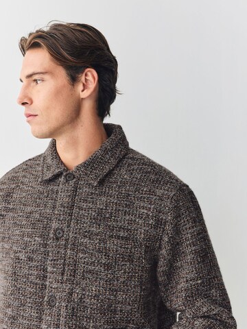 Next Tussenjas in Bruin