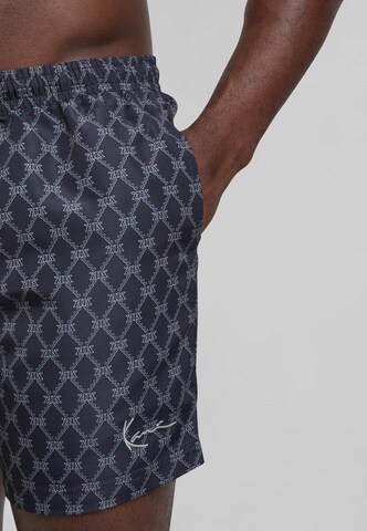 Karl Kani Plavky 'KM251-041-1 Signature Monogram Aop' - Modrá