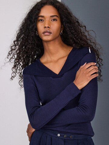 zils Next T-Krekls: no priekšpuses