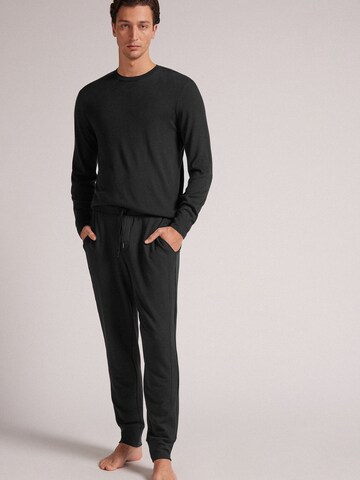 INTIMISSIMI Tapered Hose in Schwarz