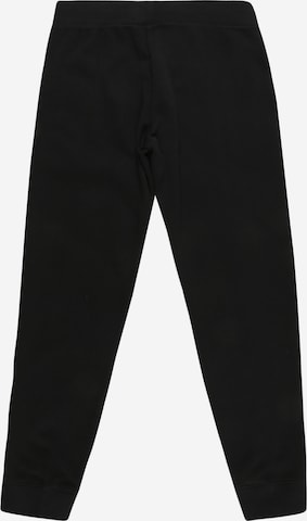 Effilé Pantalon Nike Sportswear en noir