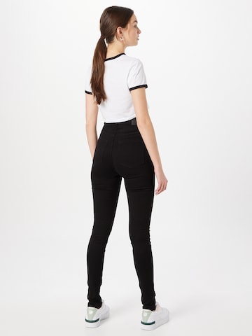 Skinny Jeans di Monki in nero