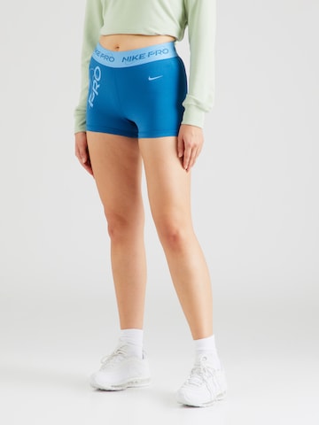 NIKE Skinny Workout Pants in Blue: front